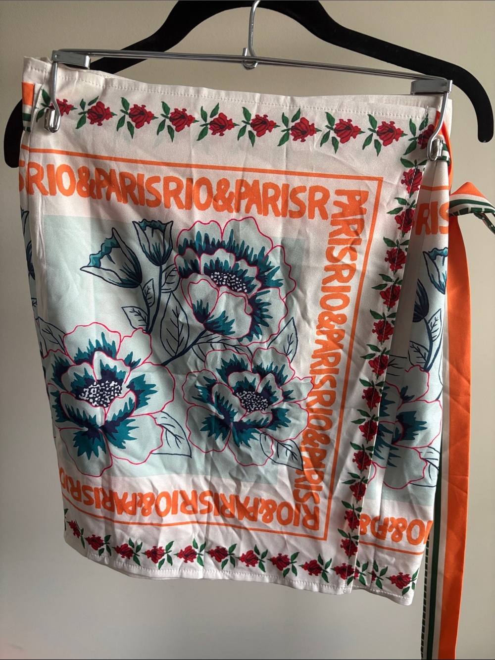 Micas Floral Orange Trim Square wrap skirt with Teal Blooms